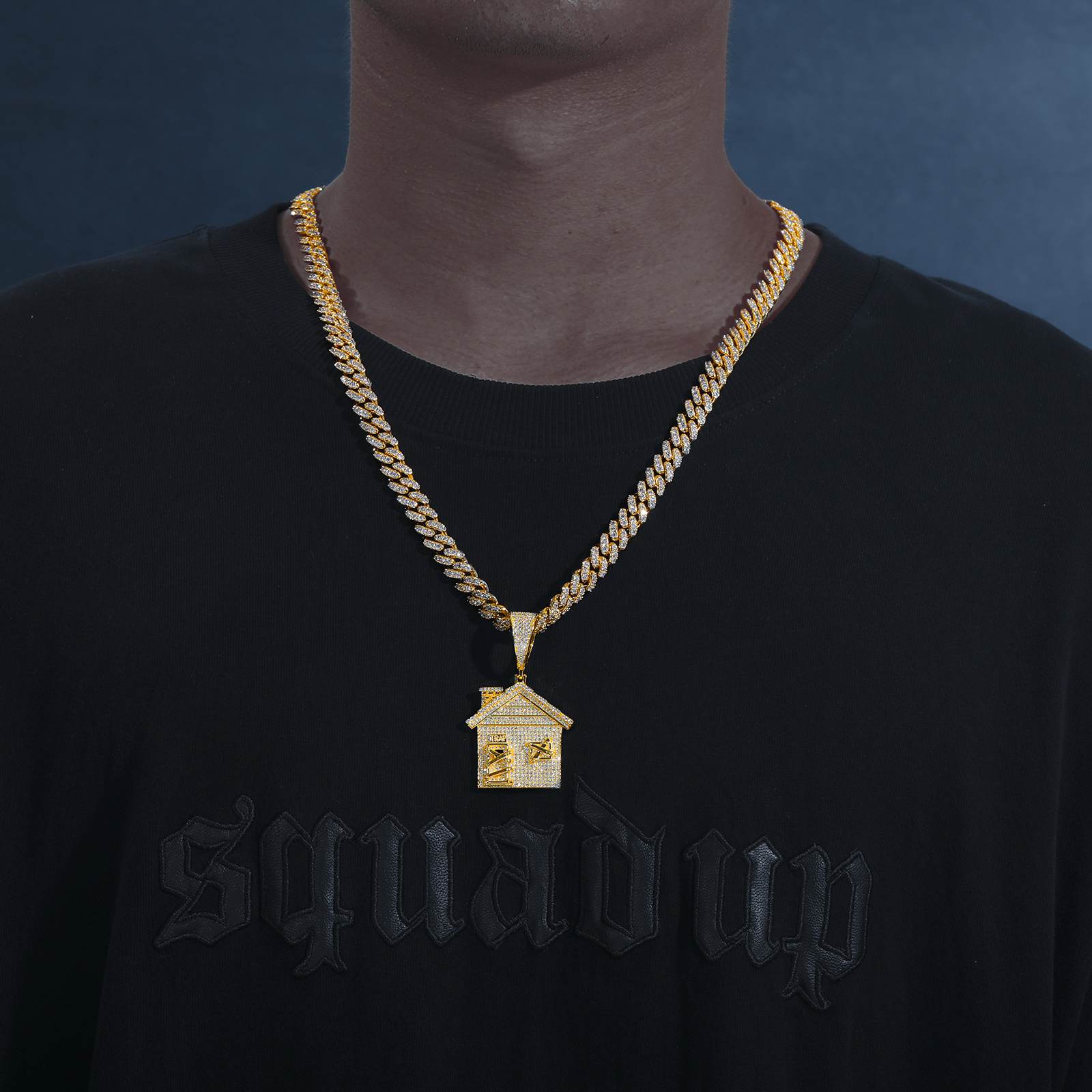 African American influencer styling gold trap house pendant on Cuban chain - lab-grown moissanite outshining diamonds | Salt-spray tested armor
