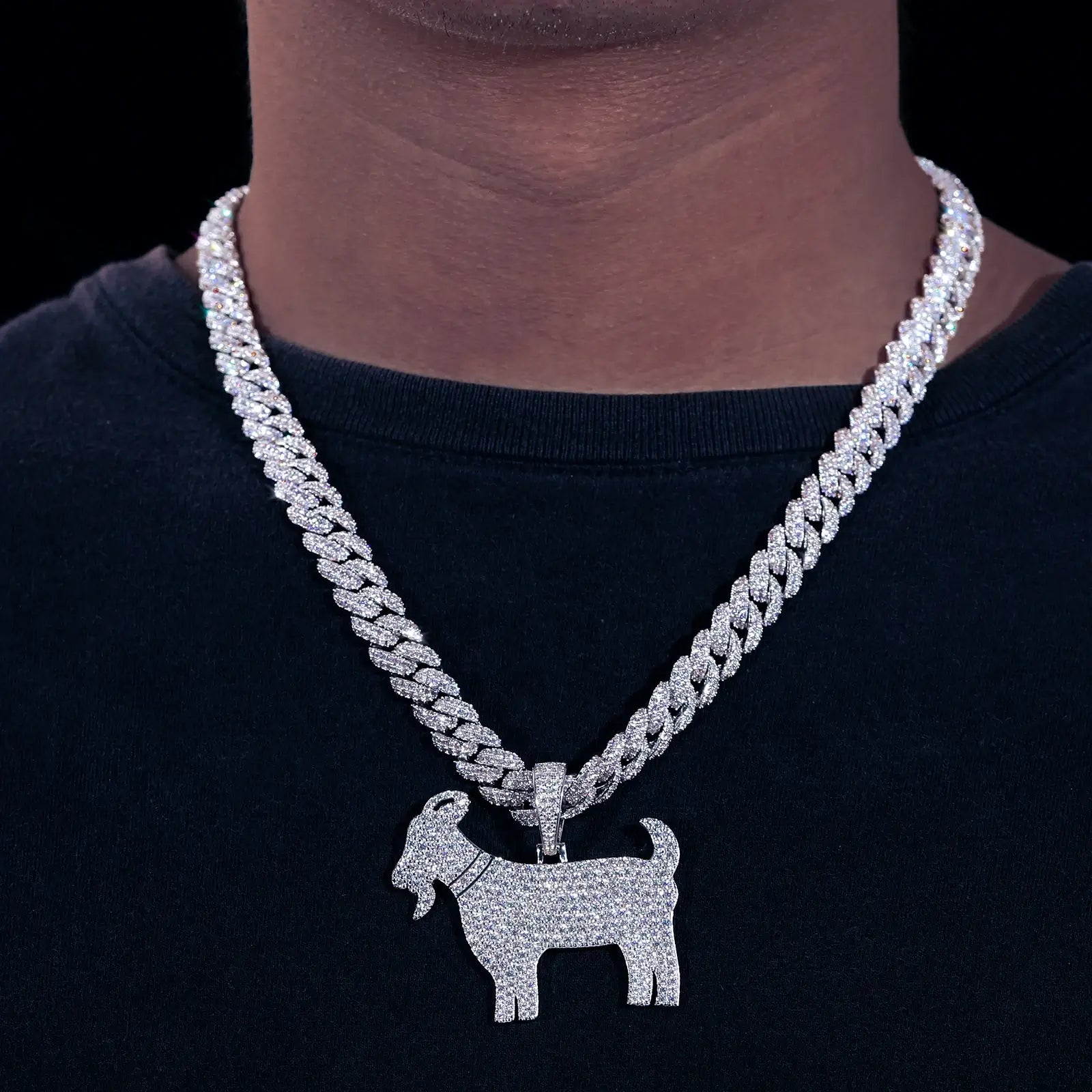 Caucasian man wearing S925 goat pendant on 10mm Cuban chain - moissanite horns blazing 2.65 RI fire | Waterproof statement necklace