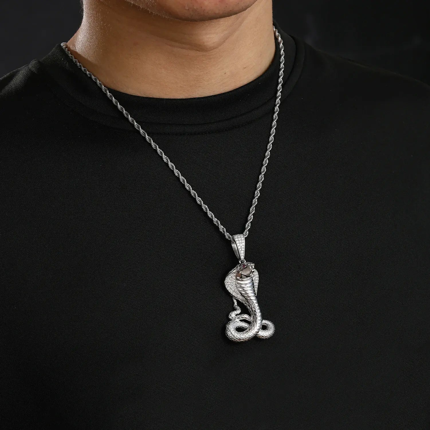 Caucasian man wearing white gold cobra pendant - S925 silver moissanite scales with hypnotic eyes | Waterproof statement necklace