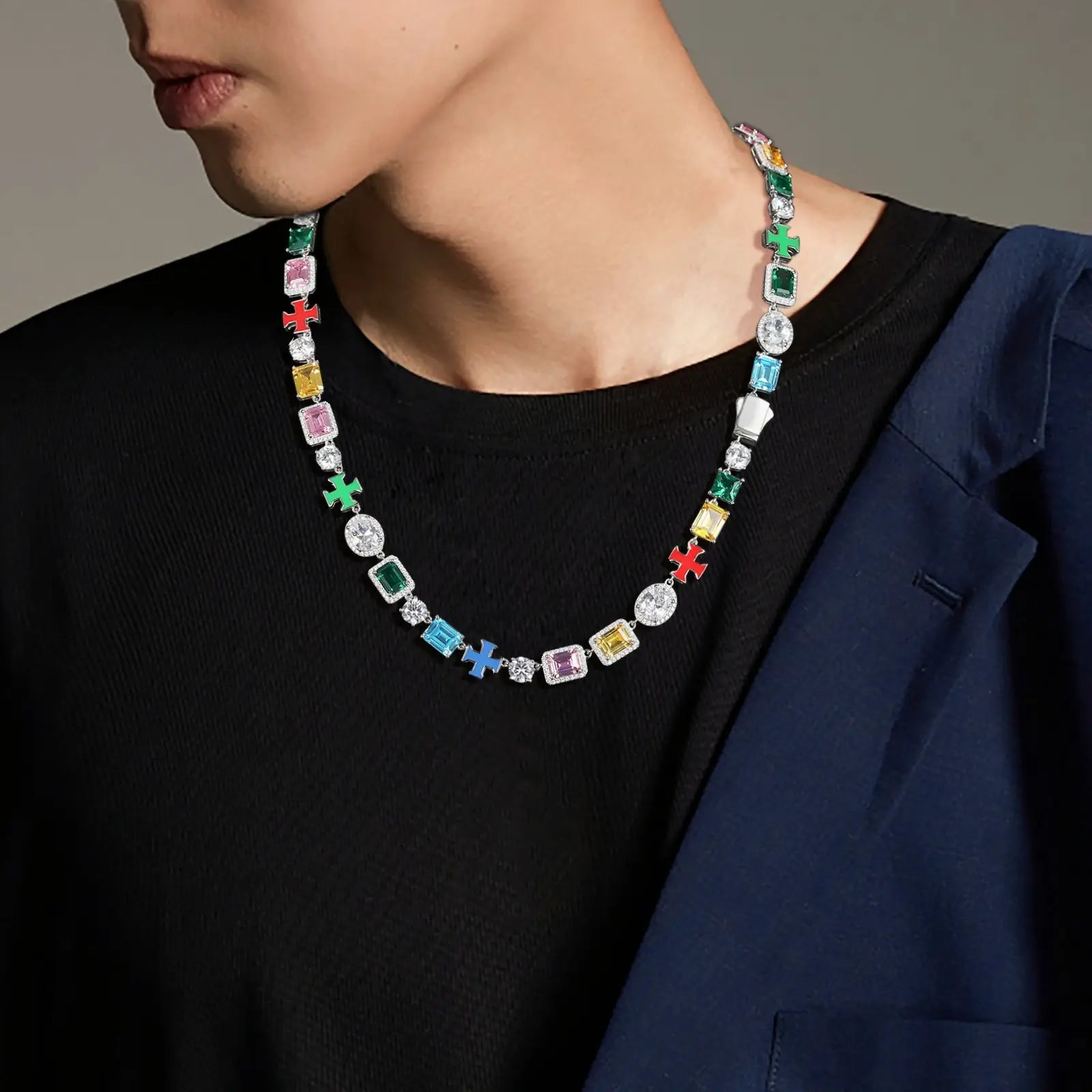 African American man styling 10mm white gold tennis chain with enamel crosses - S925 silver moissanite and rainbow gemstones | Luxurious men's statement jewelry