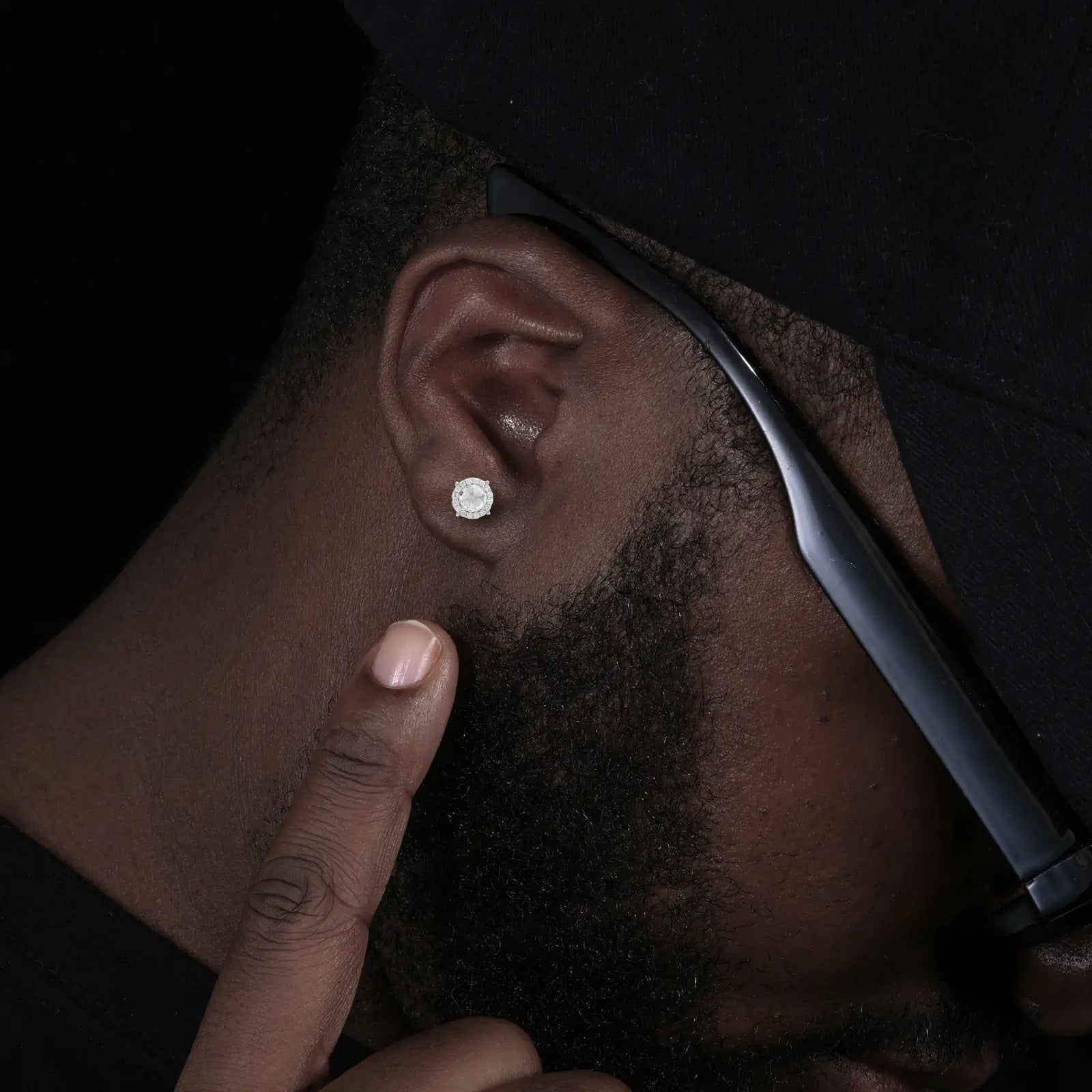 Caucasian man wearing S925 stinger earrings - inverted moissanite center with diamond-tier brilliance | Hypoallergenic men's statement jewelry