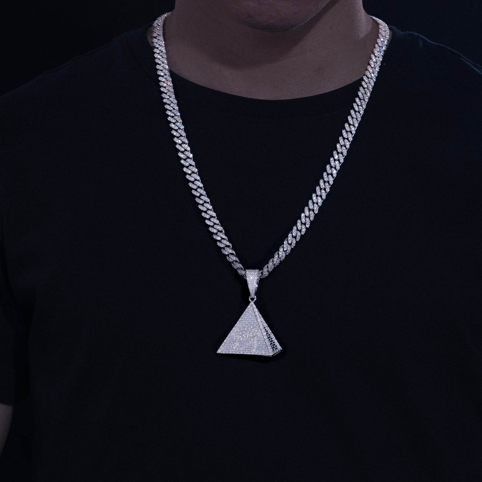African American man styling pyramid evil eye pendant on Cuban chain - hypoallergenic S925 contrasting melanin skin | Mystical street armor