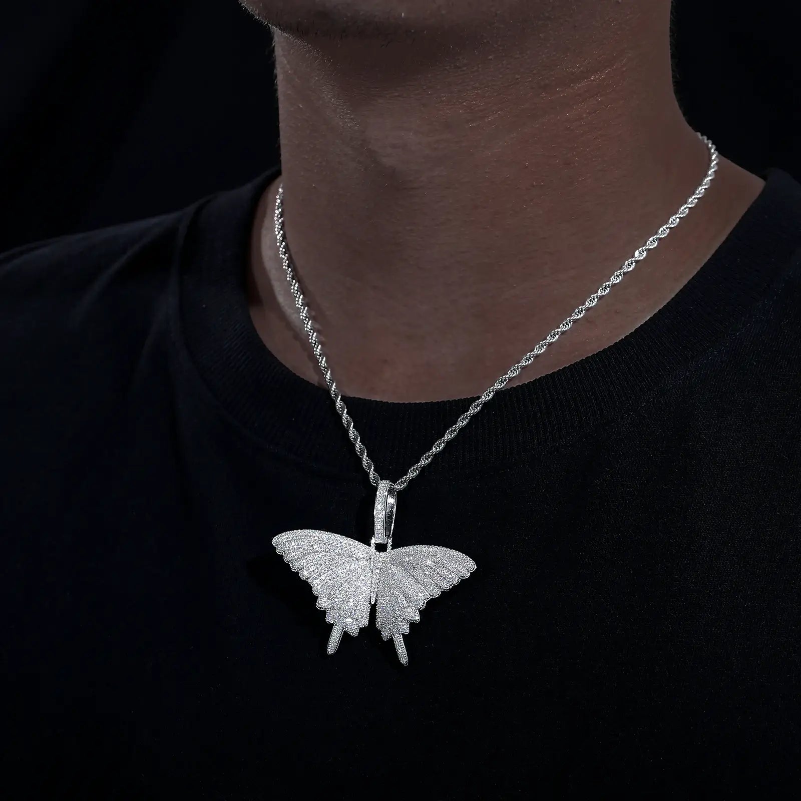 Caucasian man wearing S925 butterfly pendant on tennis chain - moissanite wings with lab-grown gem body | Waterproof hypoallergenic necklace