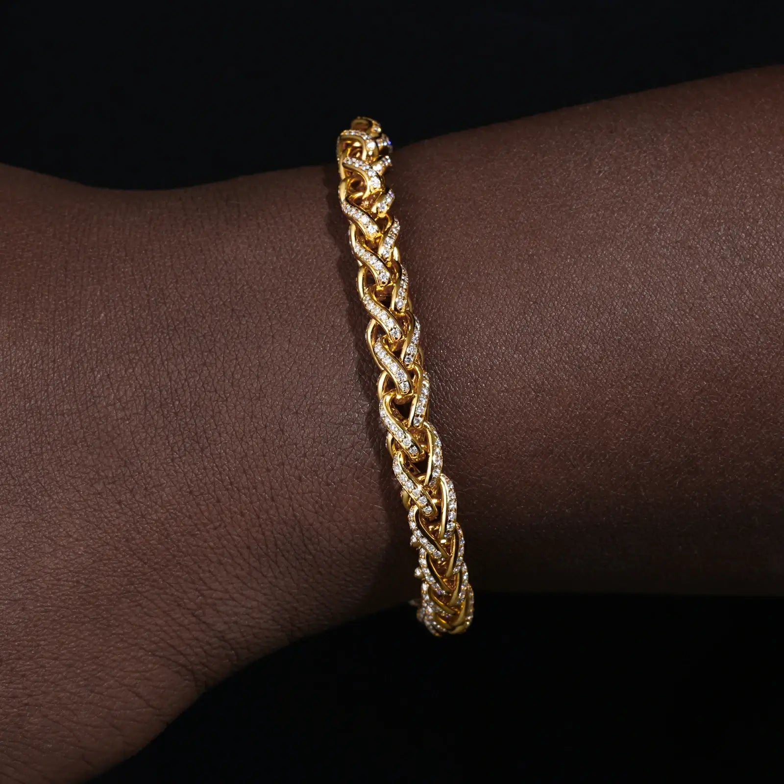 African American man styling gold twisted link bracelet - S925 moissanite helix design | Waterproof hypoallergenic men's jewelry by COCOOSTOCHERTOIS