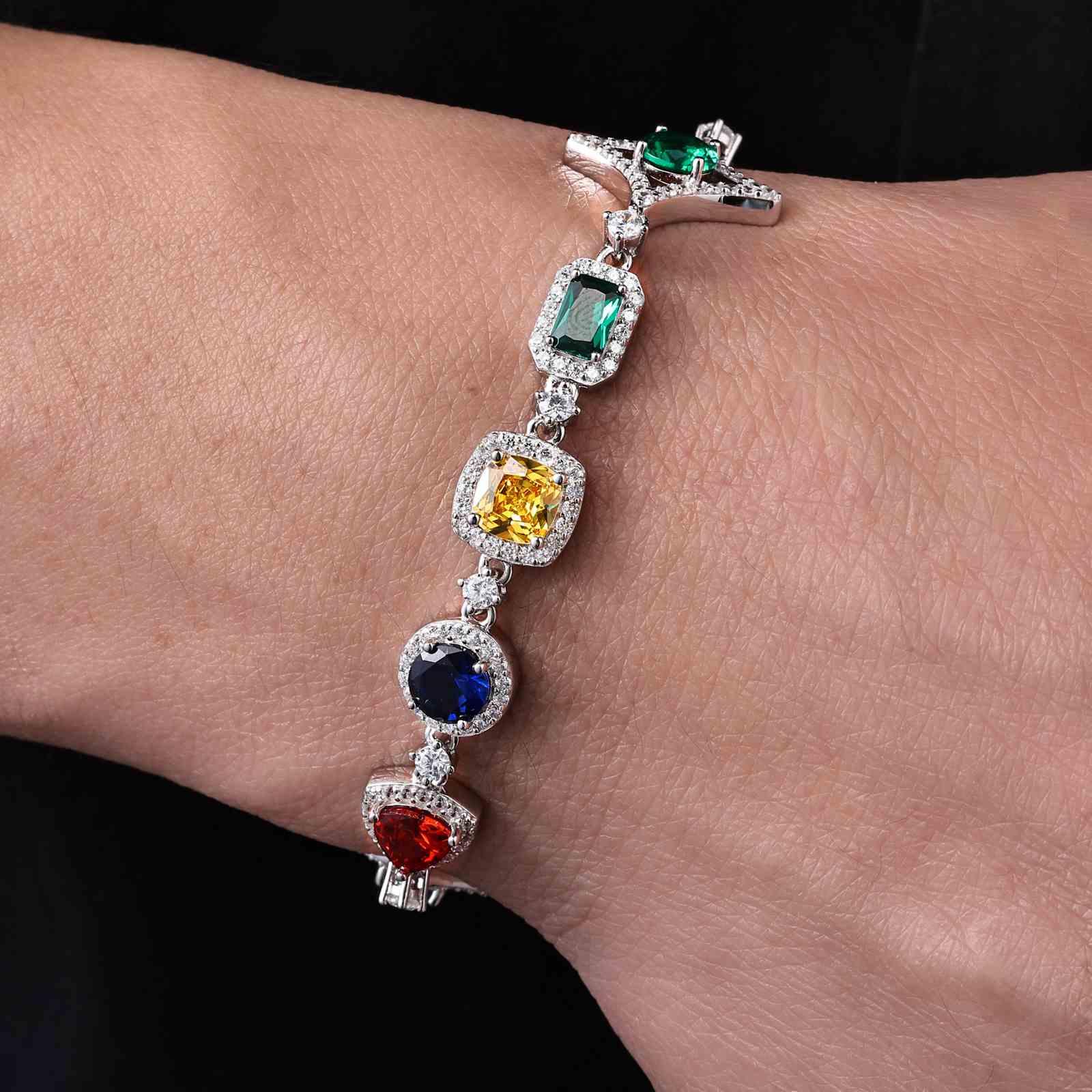 Stylish male model showcasing the 18mm S925 white gold-plated moissanite star halo bracelet with vibrant CZ stones. Perfect for hip-hop-inspired streetwear looks