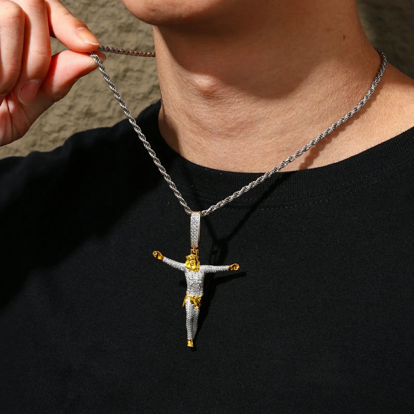 African American model showcasing gold plated crucifix pendant - S925 moissanite stones gleaming against dark skin | Church to gala versatility