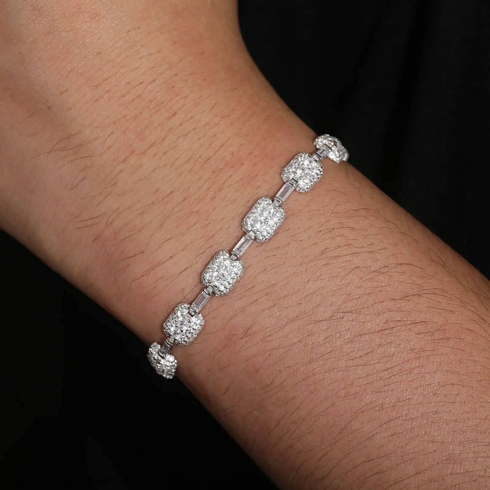 Fashionable model wearing a luxurious 7mm S925 Moissanite Chewing Gum tennis bracelet in white gold, showcasing elegance and modern style.