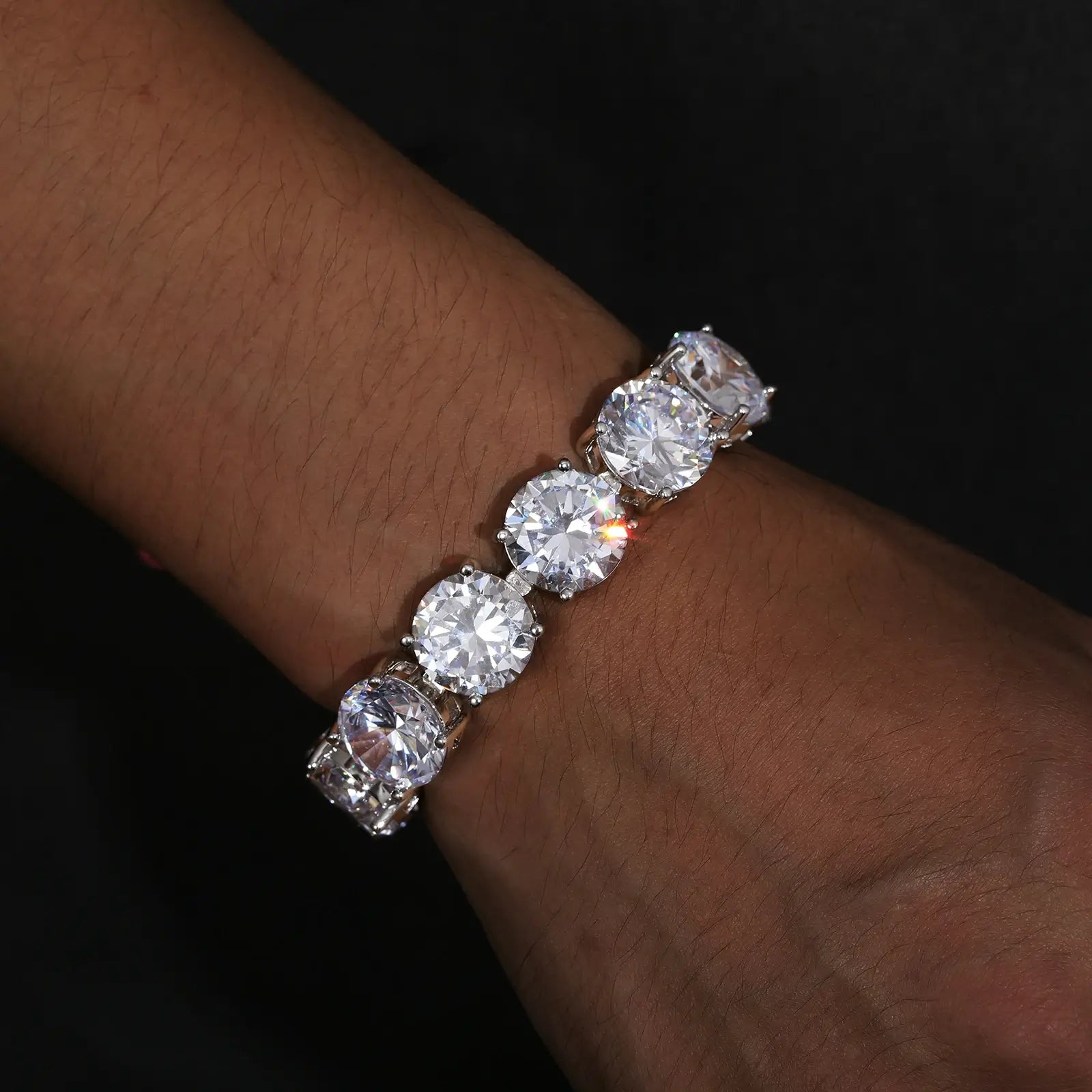 Professional male showcasing 15mm white gold moissanite tennis bracelet - luxury 925 sterling silver jewelry with diamond alternative sparkle