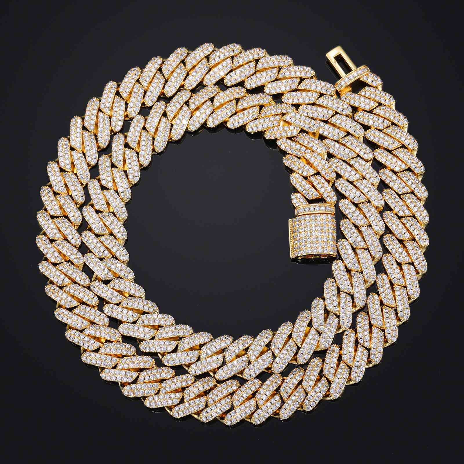 Light reflecting off the prong-set CZ diamonds on the 14mm Cuban Link Chain, creating a dazzling disco ball effect