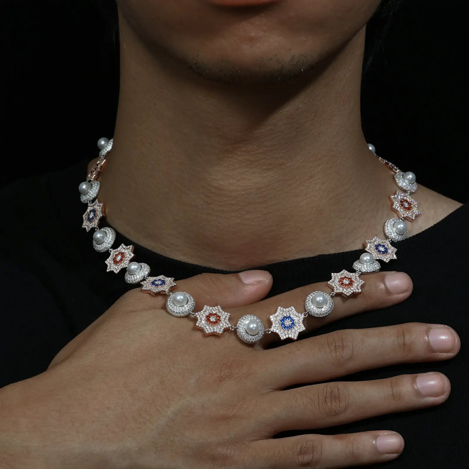 African American man modeling the 17mm sterling silver moissanite sun and pearl halo link chain - urban style statement with VVS moissanite stones and lustrous pearls