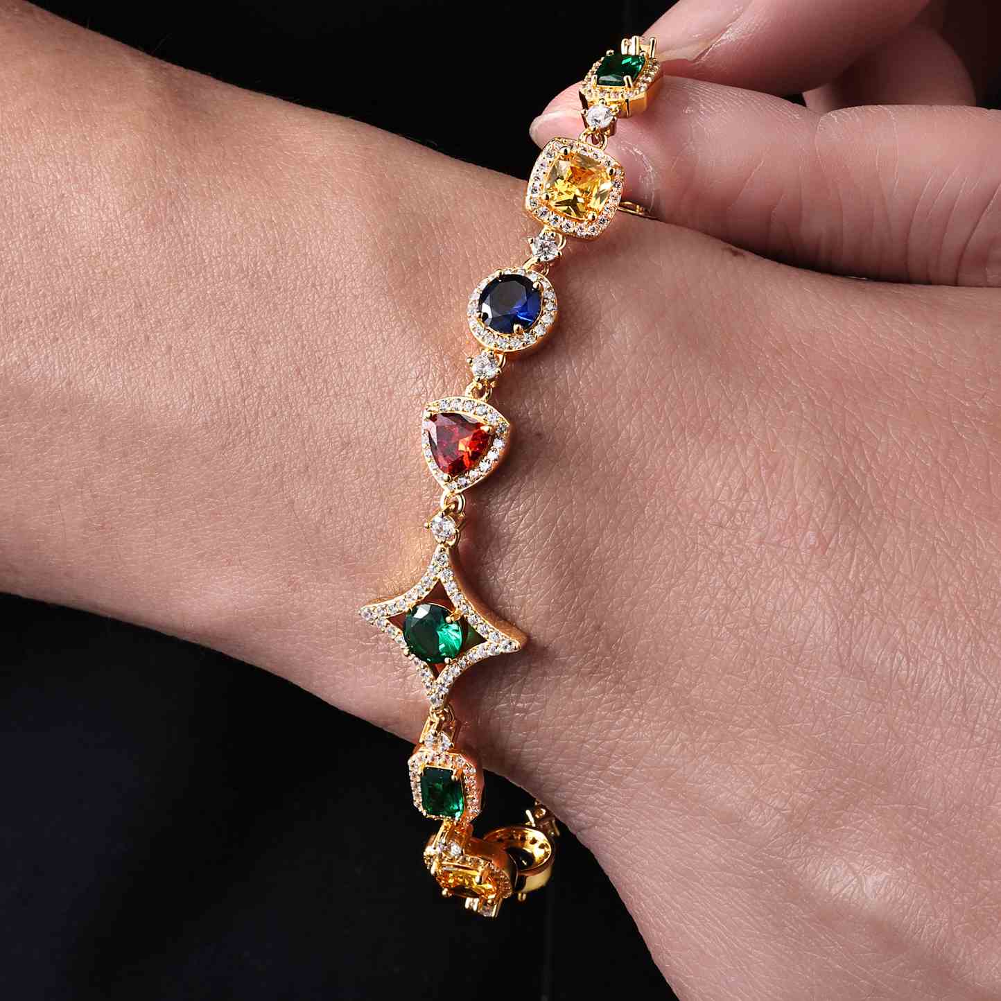 Edgy male model rocking the 18mm yellow gold-plated moissanite bracelet with geometric CZ stones. Combines luxury and urban street style