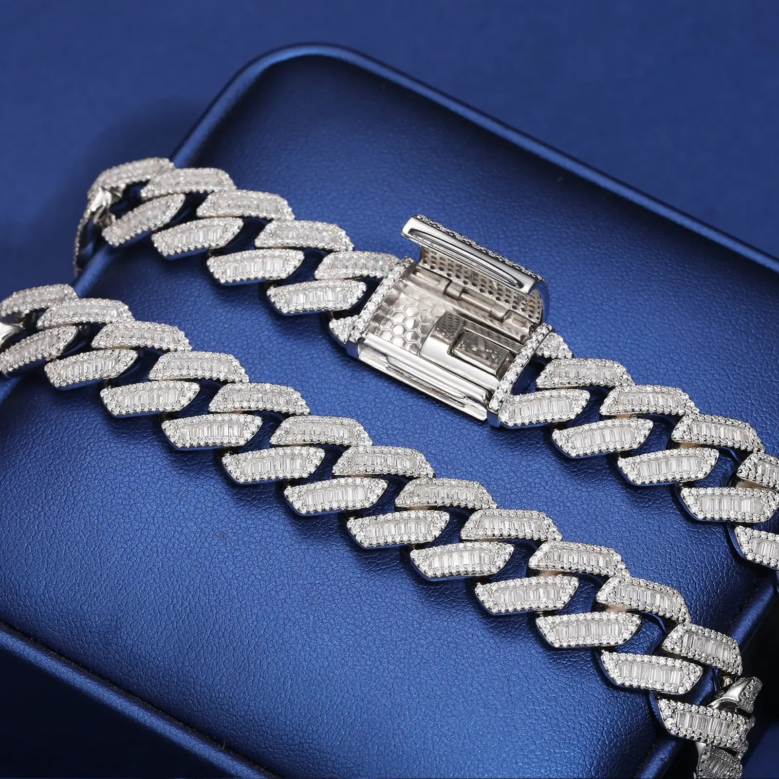 Detailed close-up of the secure clasp on a 14mm white gold moissanite Cuban bracelet, highlighting premium craftsmanship on blue background.